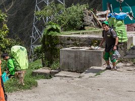 Local porters from the 4-day hike start the treck back down a short-cut to the railway.