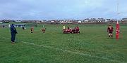 Doug watched a local rugby game in the wind and rain