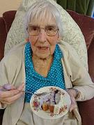 Lilian eating Terry and Judy's wedding cake